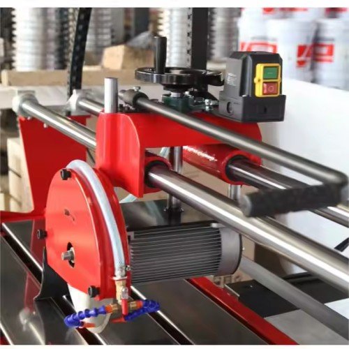 Stone Table Saw Machine for cutting granite, marble, and ceramic tiles with water cooling system.